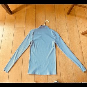 Blue ruffle turtleneck